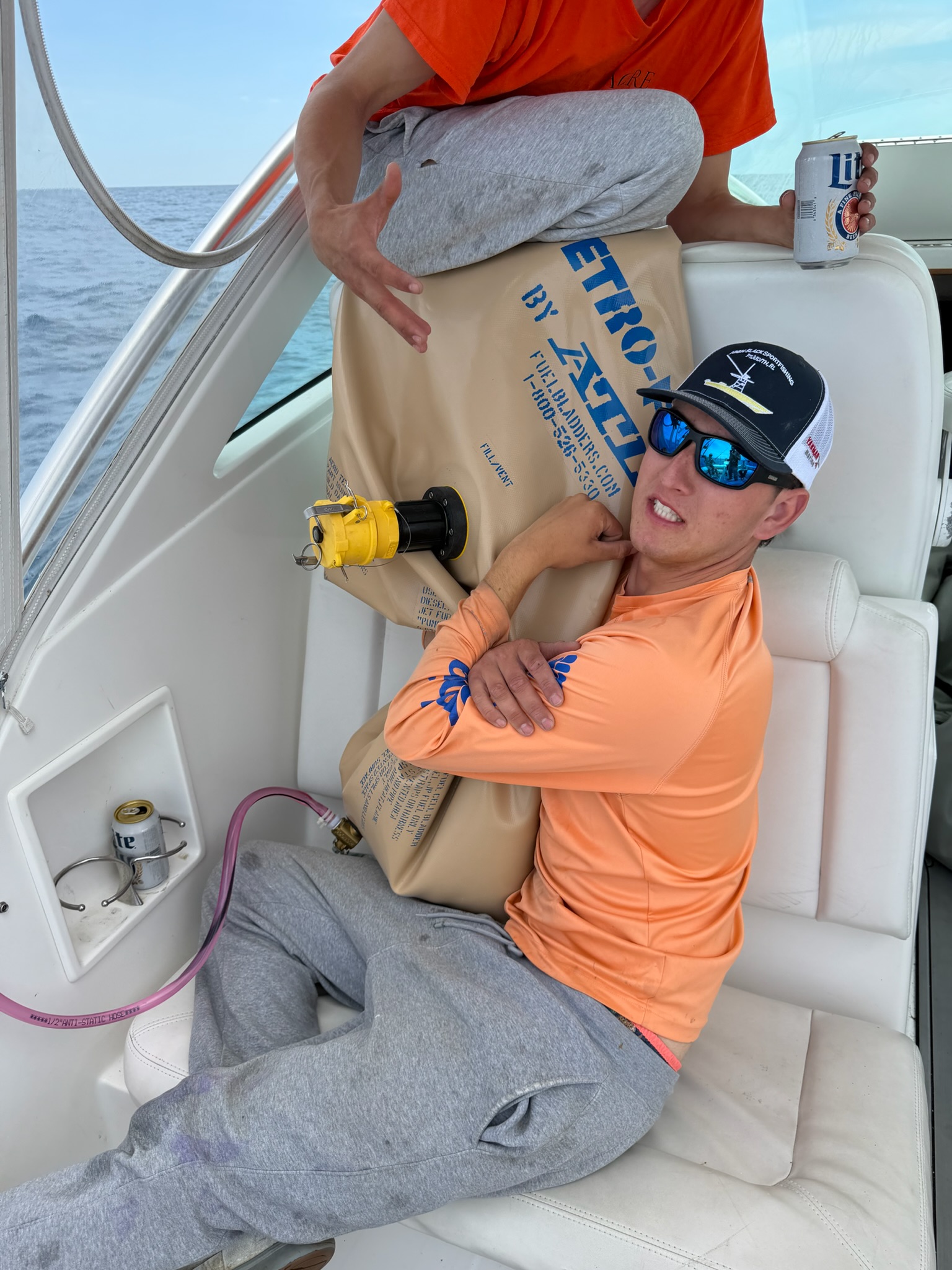 Angler hugging fuel bladder on Albemarle