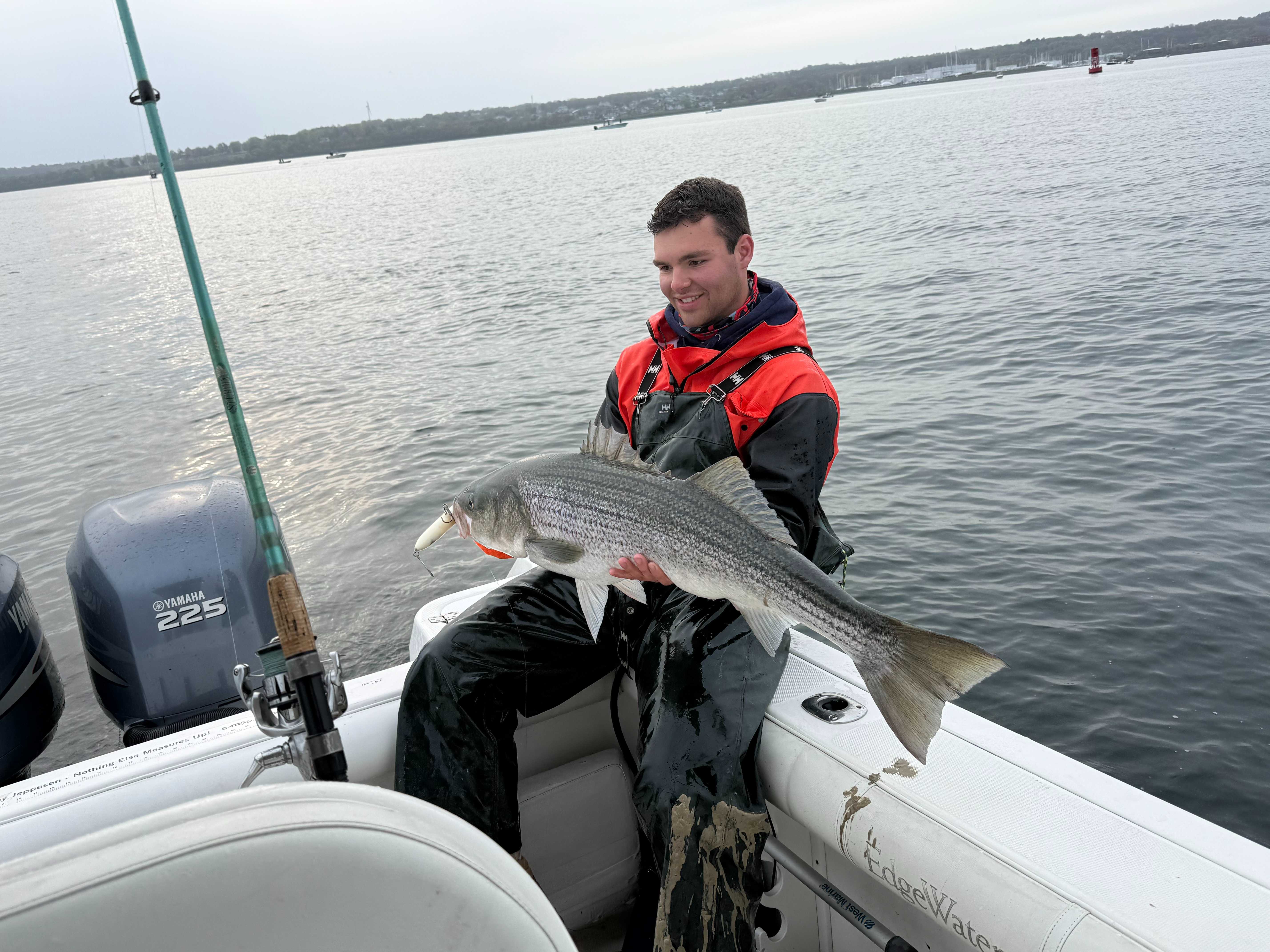 Angler holding a striped bass