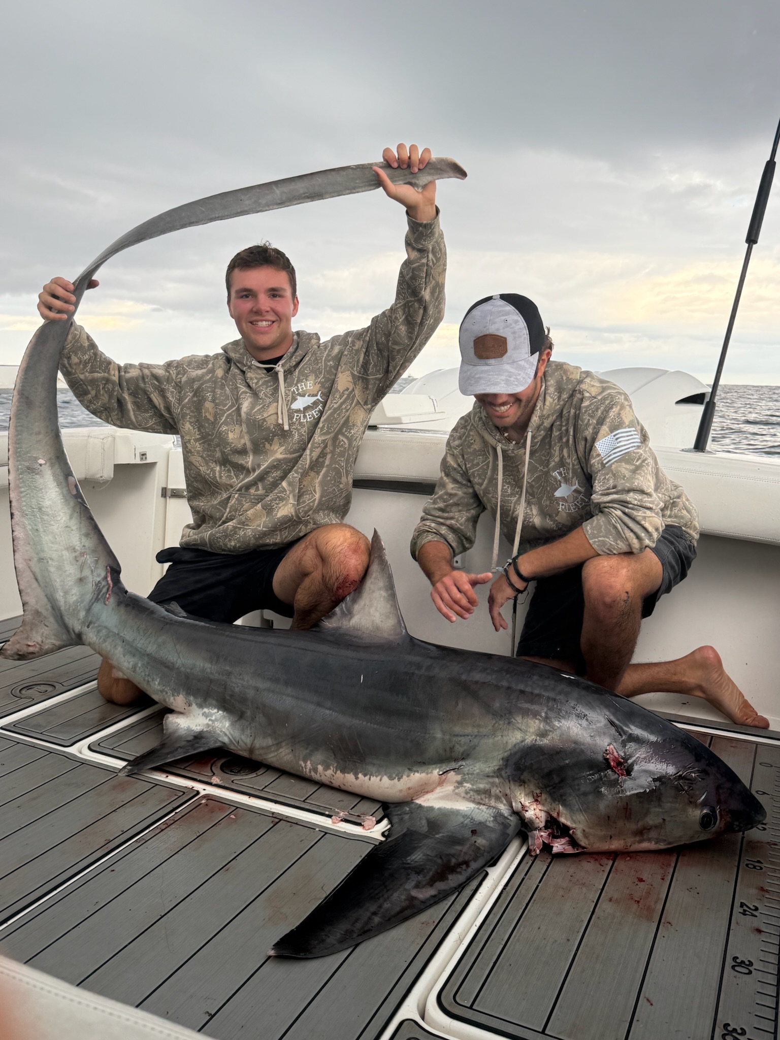 Two anglers with thresher shark on the Albemarle