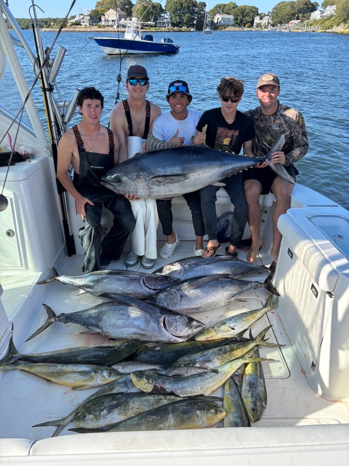 Crew with bluefin tuna and a deck of fish